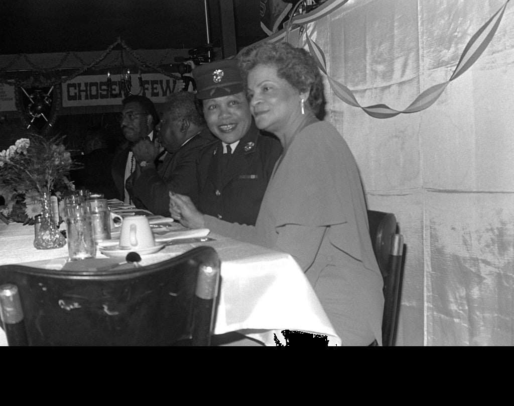 The first black woman Marine, Annie E. (Graham) Gilliard (foreground), and the first black woman Marine officer, Chief Warrant Officer Annie L. Grimes, are the guests of honor at the Monfort Point Marine Association (MPMA) Marine Corps birthday ball. (U.S. Marine Corps photo by Staff Sgt. Laville. Combined Military Service Digital Photographic Files. Public Domain)
