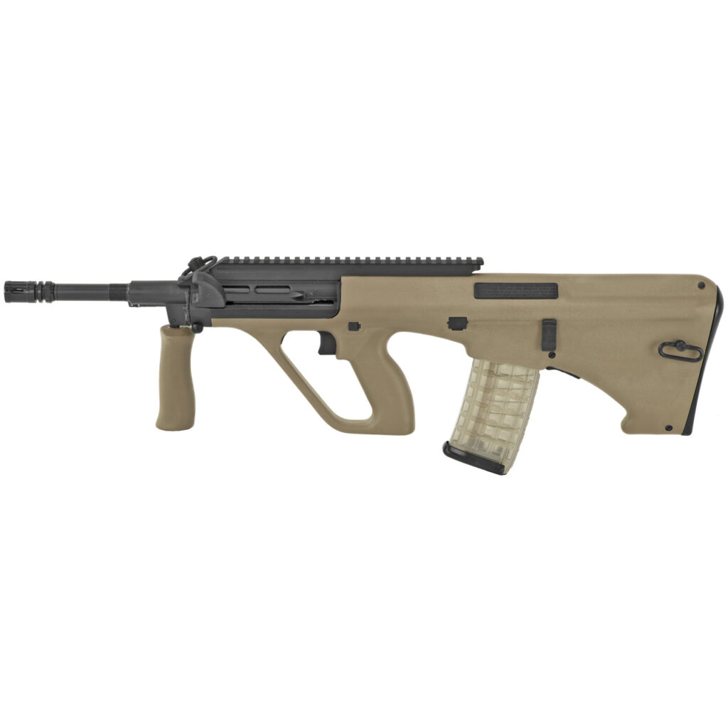 A tan Steyr AUG bullpup rifle is shown against a white background. It features a transparent magazine and an integrated forward grip.