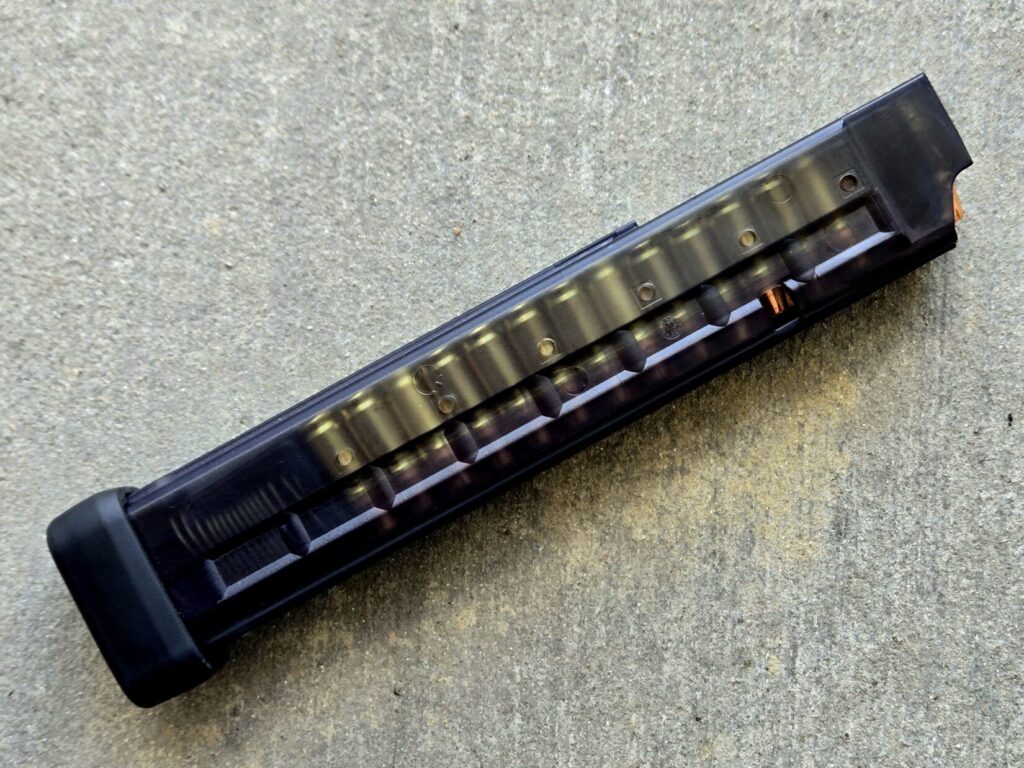 A 9mm magazine loaded with 30 hollowpoint bullets