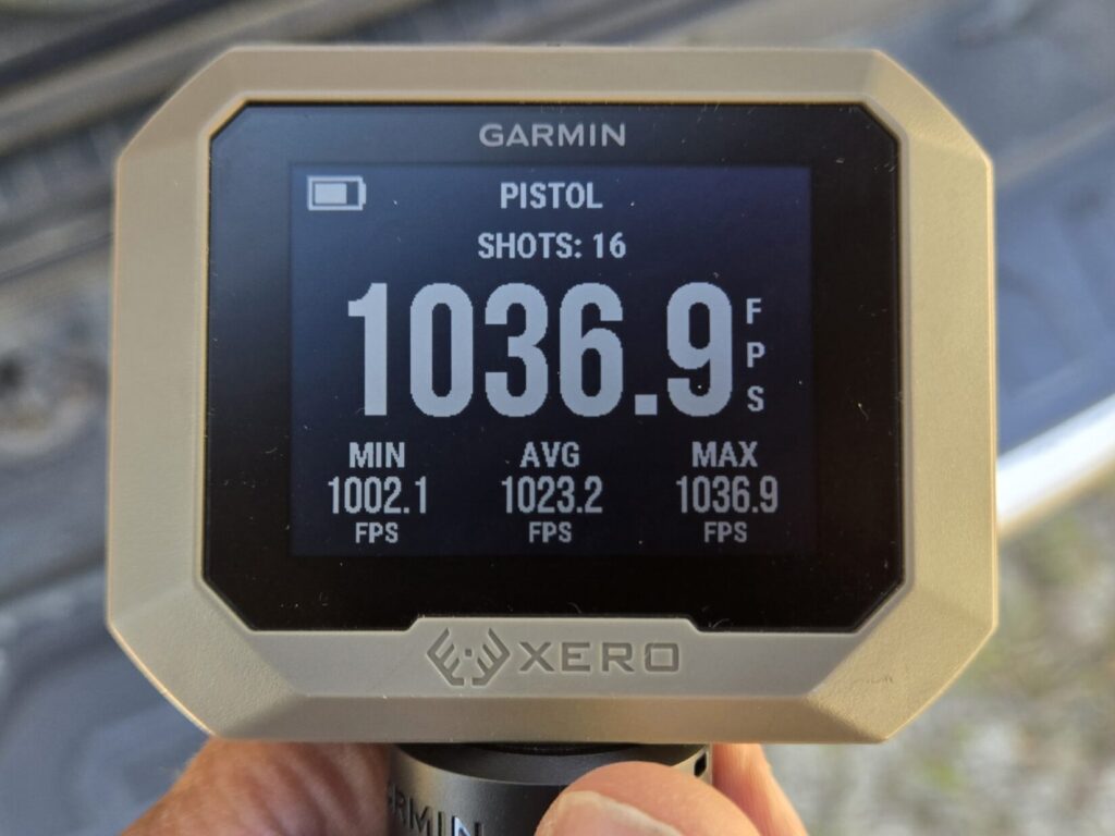 A chronograph display showing velocities in feet per second