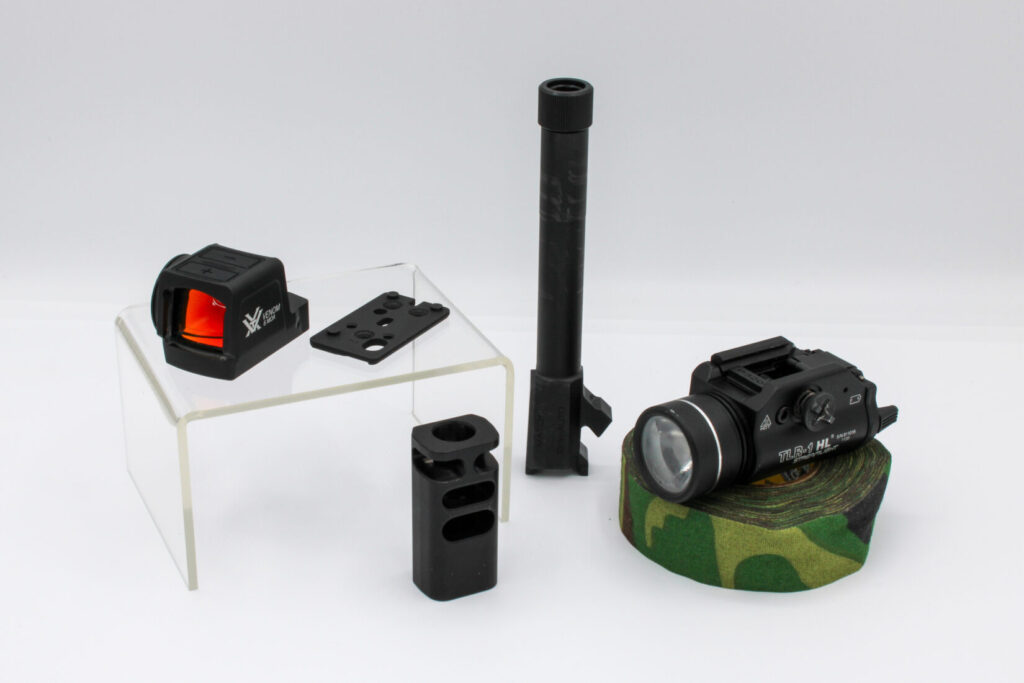 Components for Springfield XD-M Elite 10mm build. Vortex Venom Micro Enclosed Red Dot, Threaded Factory Barrel, OSP Plate, Springer Precision Compensator, Streamlight TLR-1 HL, and Howies Hockey Tape. 