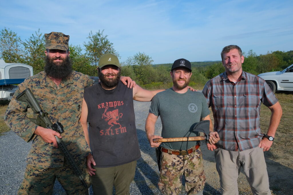 four men lined up after the Lightfighter Challenge. 1st, 2nd, 3rd place winner and company owner, Jared Ross.