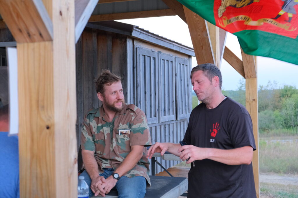 Jared Ross (right) discusses the Lightfighter Challenge with a competitor