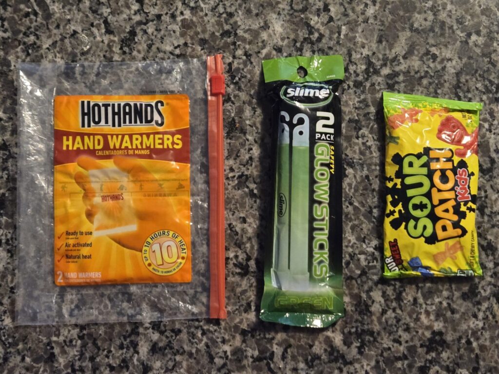 hand warmers, glow sticks, and sour patch kids candy