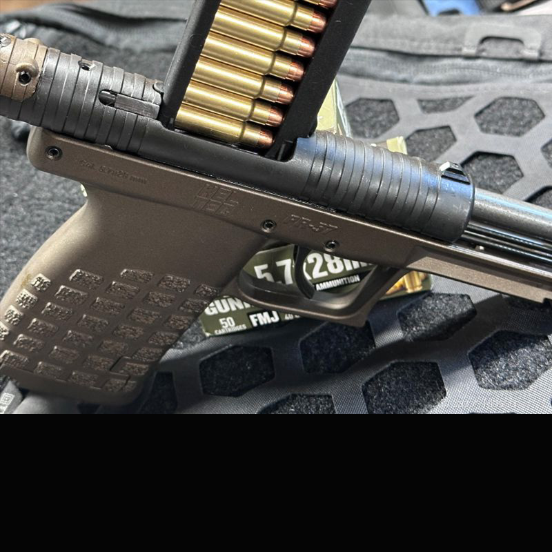 PR57 with a loaded stripper clip inserted into the top of the gun. 