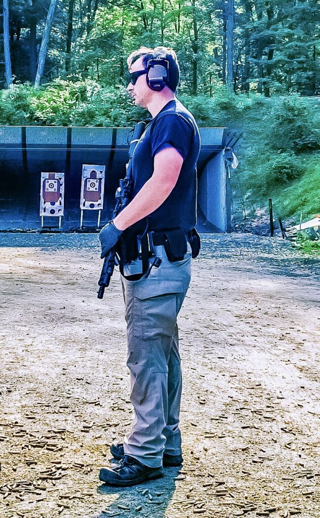 Police firearms instructor observes students officers