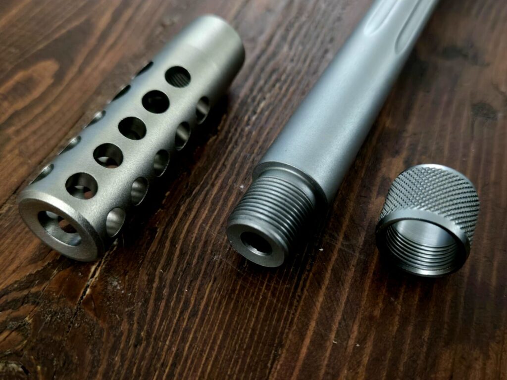A muzzlebrake, threaded barrel, and thread protector