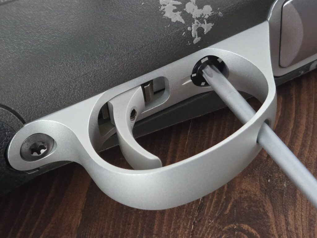 the trigger guard of a rifle with Torx wrench