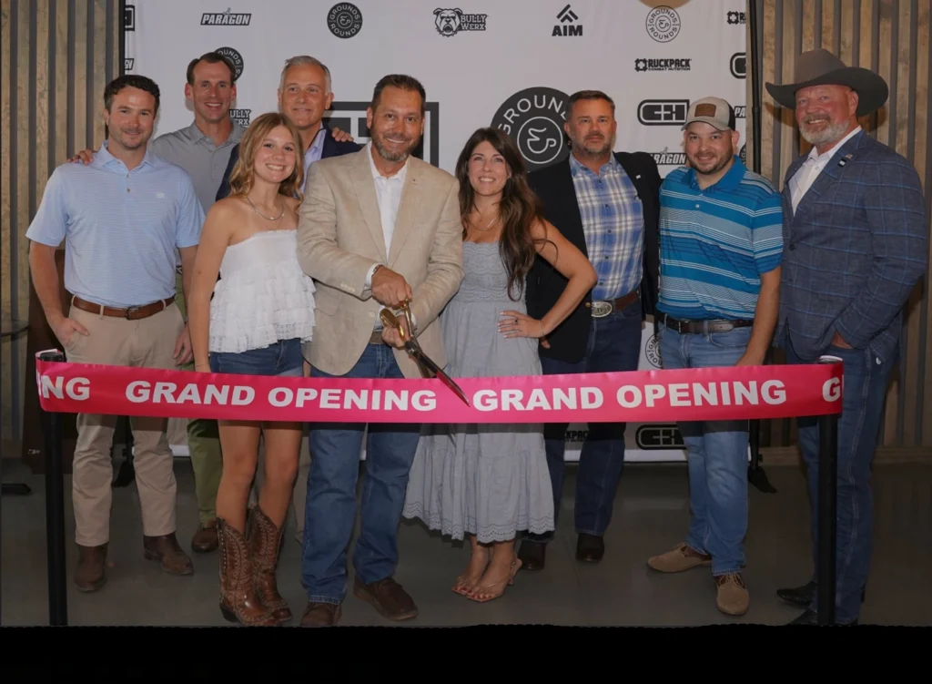 People cutting the ribbon at C&H Precision's grand opening