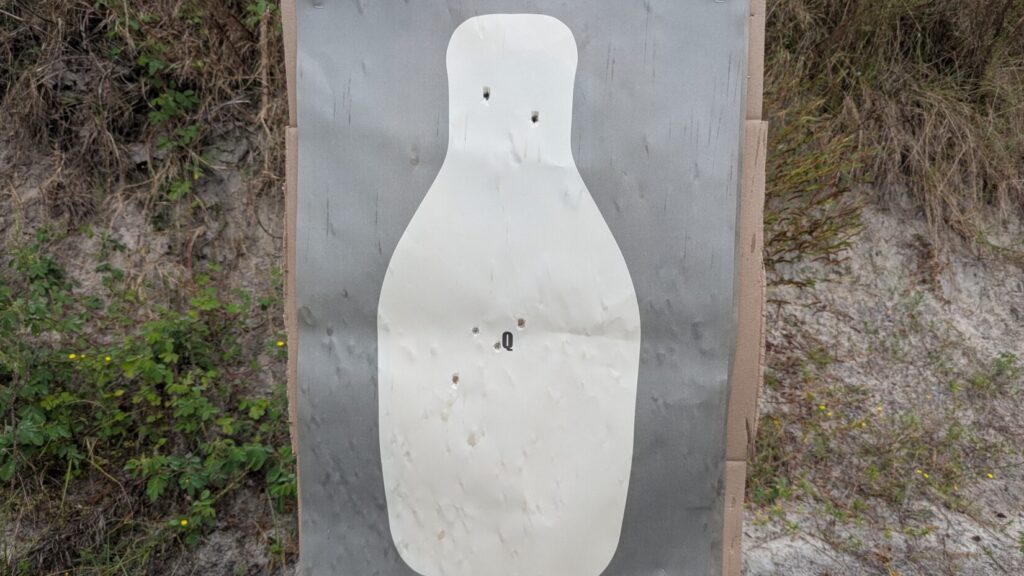 target showing multiple gunshots at outdoor range.