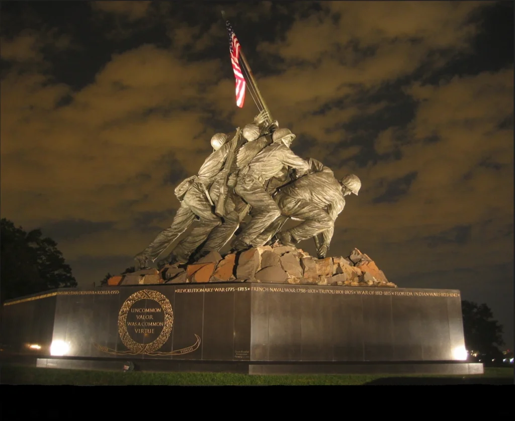 The US Marine Corps World War II Memorial at night.