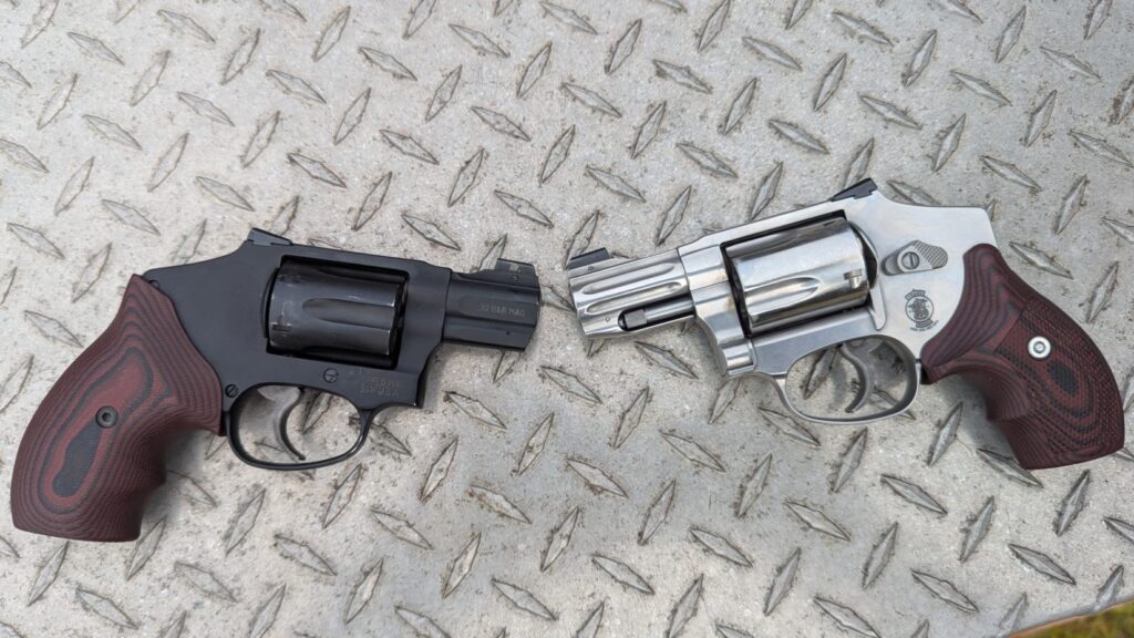 Top-down view of the S&W 432 UC and S&W 940 revolvers with custom grips on a metal diamond plate surface.