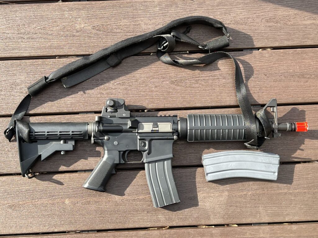 Airsoft M4 CQBR with VTAC sling next to a real USGI 20 round magazine
