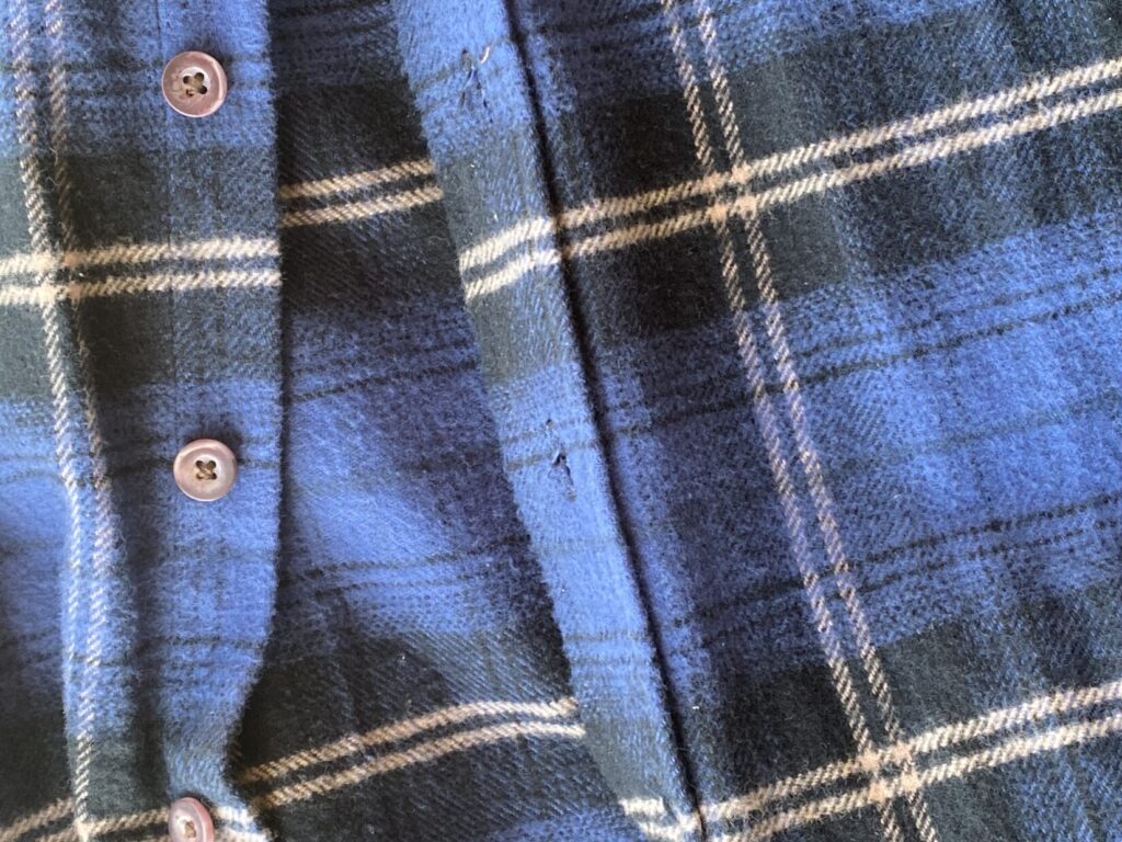 closeup of flannel and buttons in a shirt