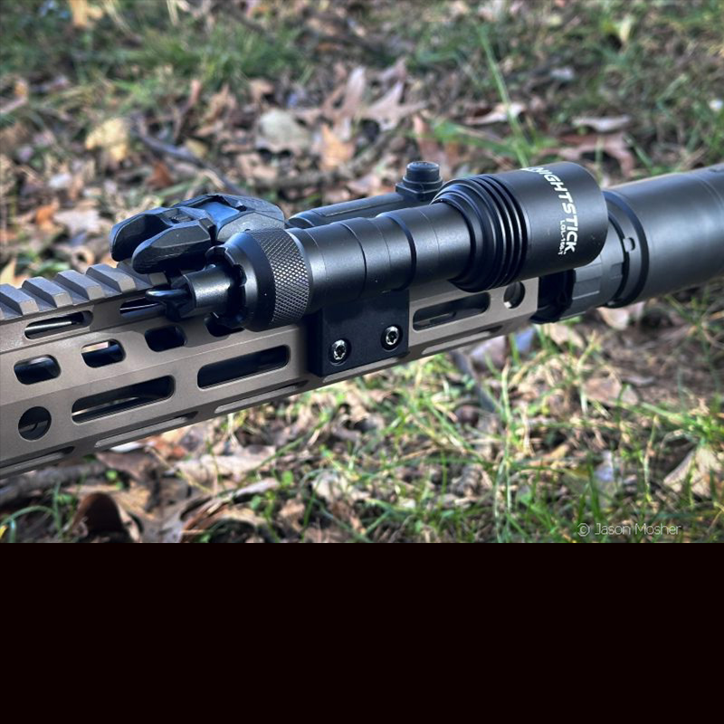 A black light mounted to the handguard of an AR-15. 