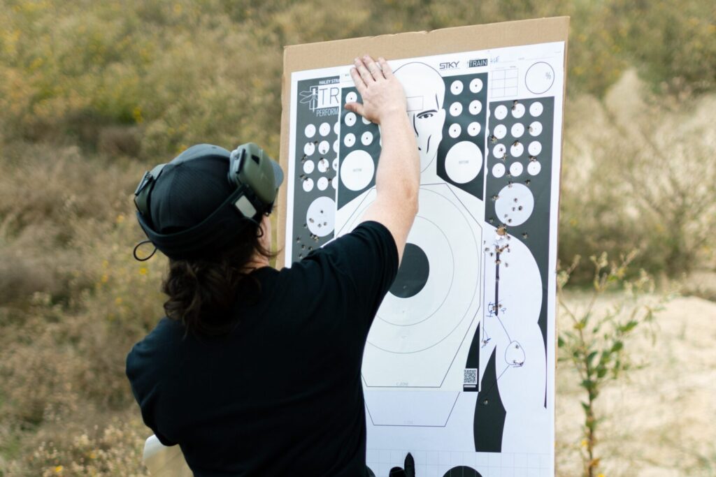 man setting up STKY Target at outdoor range