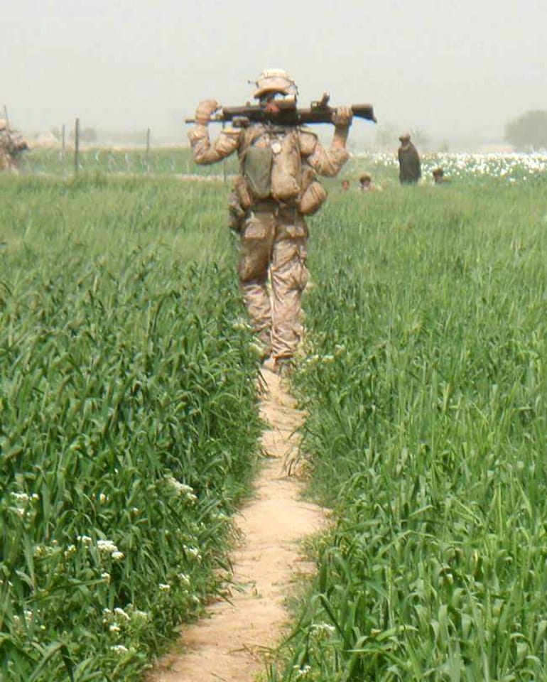 Marine caring M240 in Afghanistan