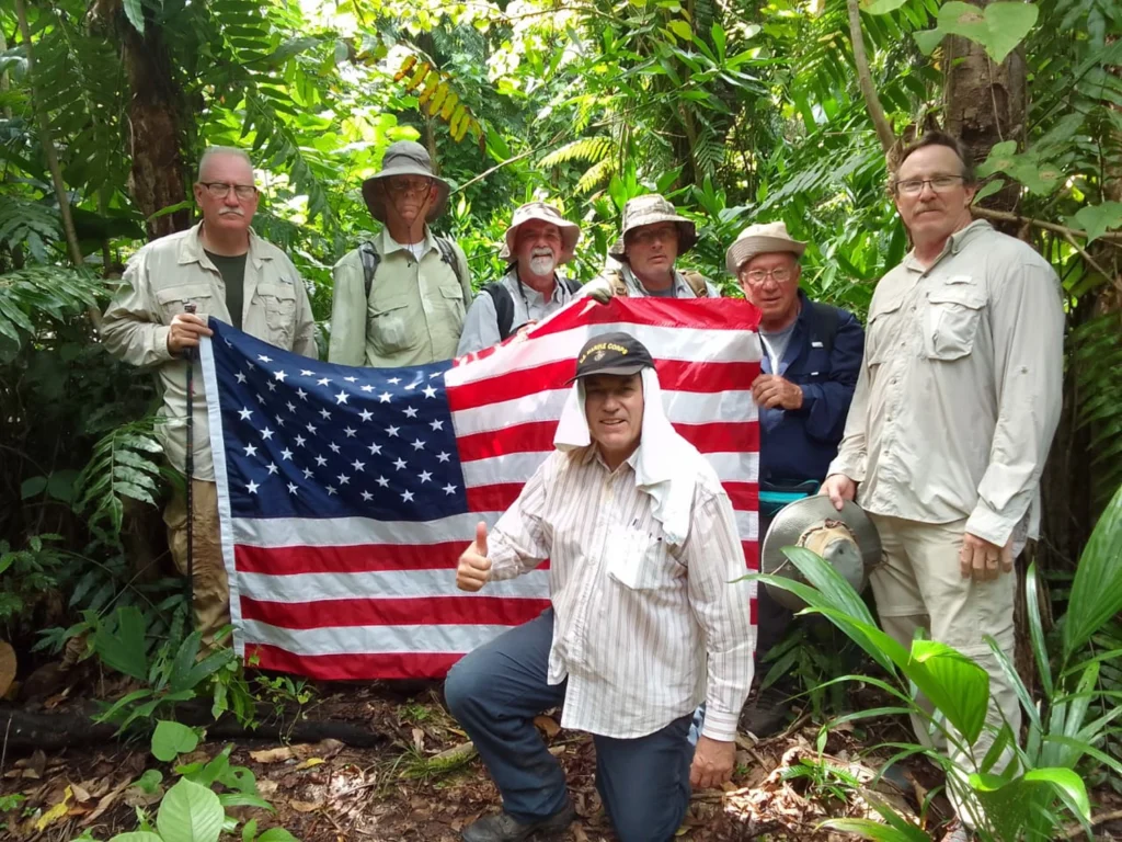 Men with an American Flag on Guadalcanal where John Basilone won the Congressional Medal of Honor