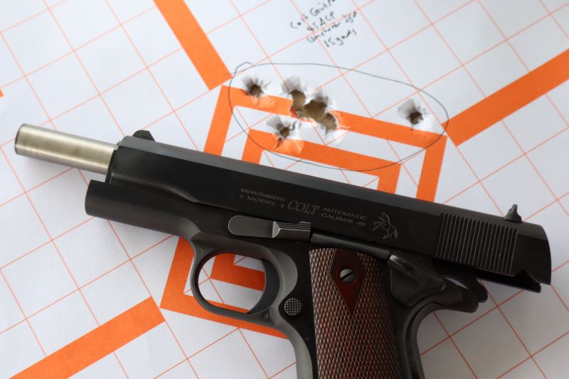 colt 1911 with a paper target