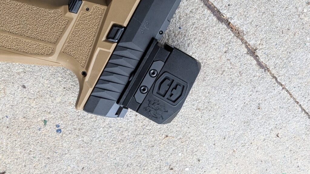 Tan and black pistol with a Swampfox mounted