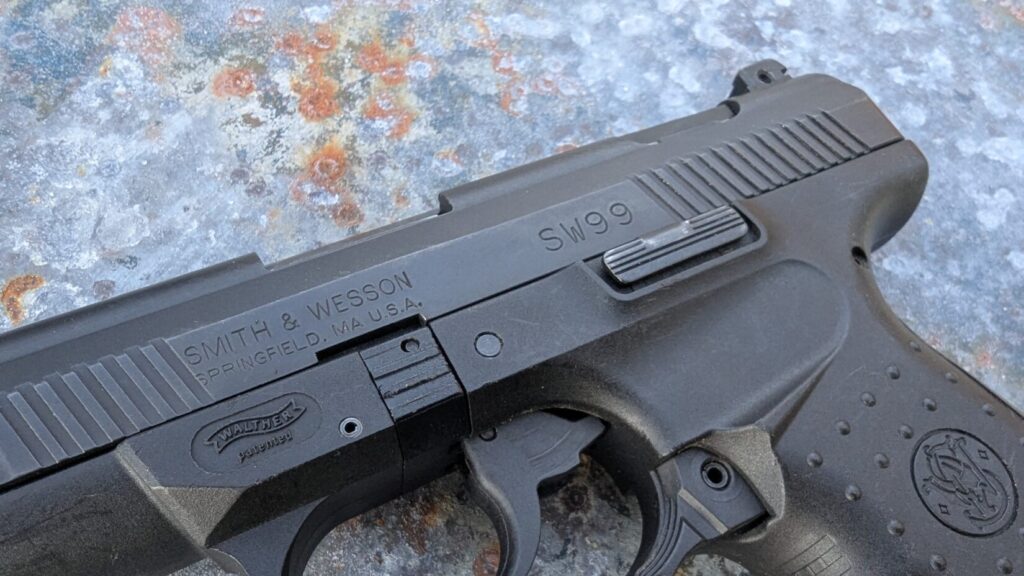 Close-up of the slide markings on the Smith & Wesson SW99 pistol.
