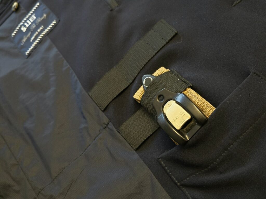 A RMT Tourniquet inside of a pocket and secured with elastic strap