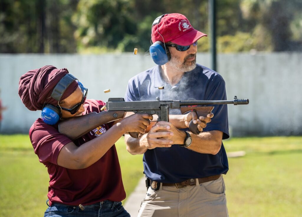FBI Jacksonville’s Principal Firearms Instructor helps a community leader shoot a historic Thompson Model 1928 (Tommy Gun). In October 2021, FBI Jacksonville partnered with the Volusia Sheriff’s Office (VSO) to host the first joint FBI-VSO Citizens Academy at the VSO training facility in Daytona Beach. (image: FBI)