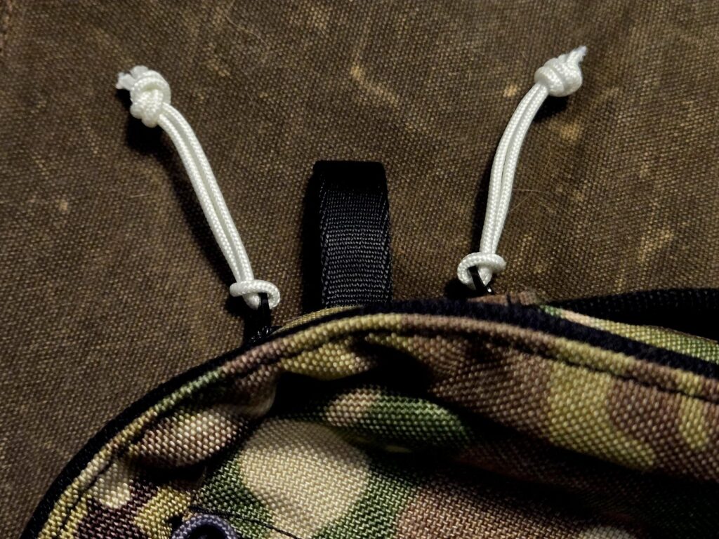 White zipper pulls on a fanny pack