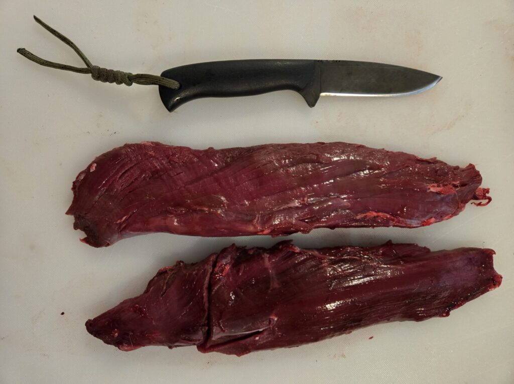 Two deer tenderloins and a hunting knife, the reward for avoiding butchering mistakes after a clean shot