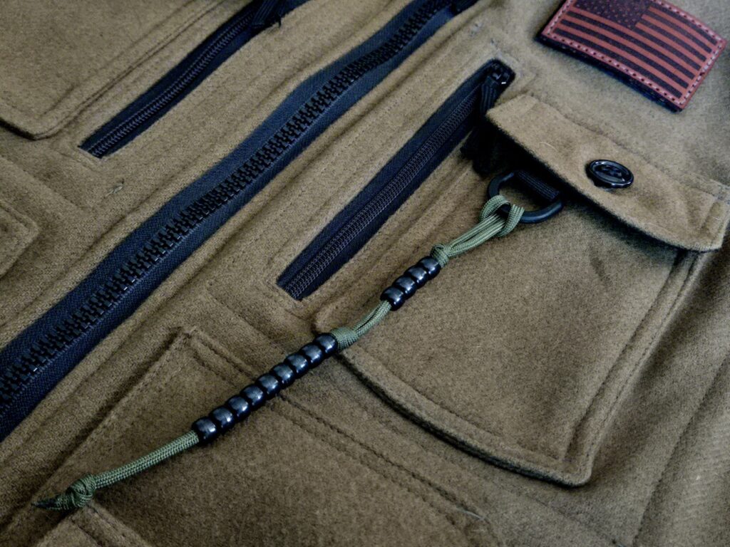 Pace beads attached to a green wool vest