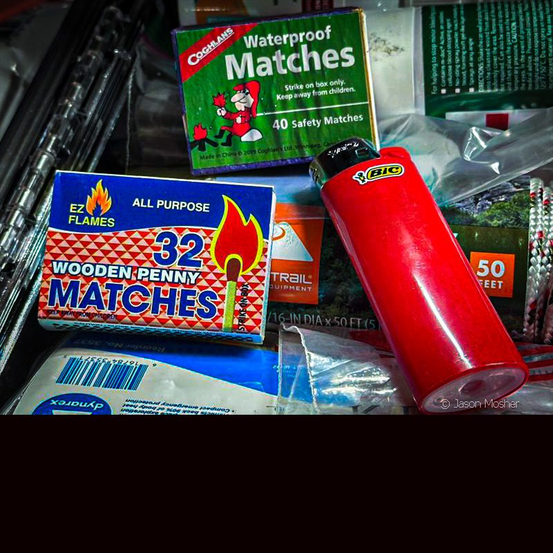 A box of matches in a red and blue box, next to a right bic lighter. 
