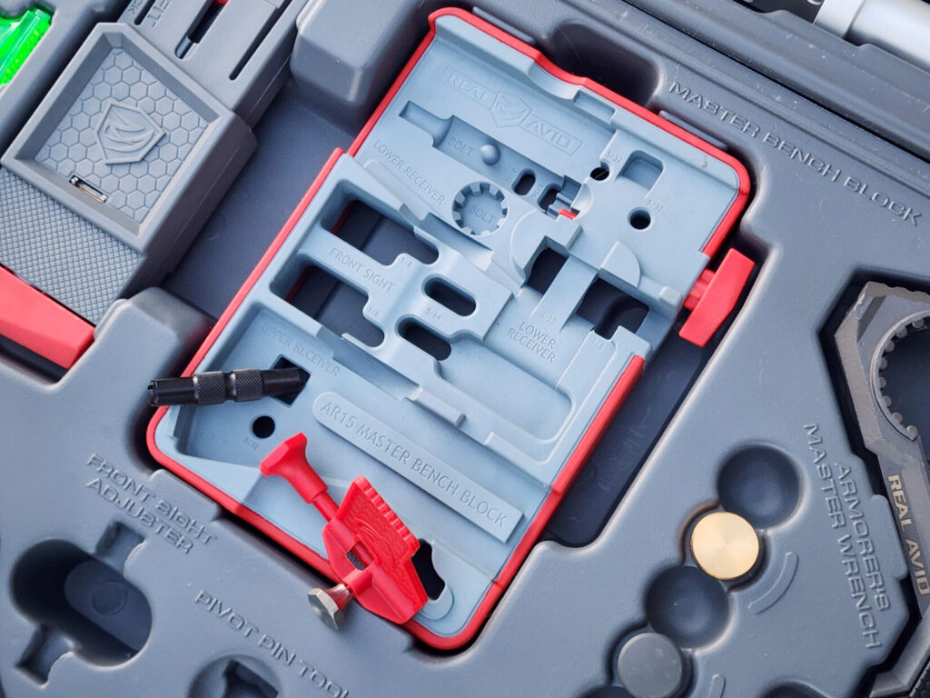 Master bench block, front sight adjuster, and pivot pin tool. AR-15 armorer's tools