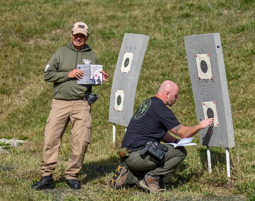 in this picture law enforcement officers attending a War HOGG Tactical course are scoring their B8 targets