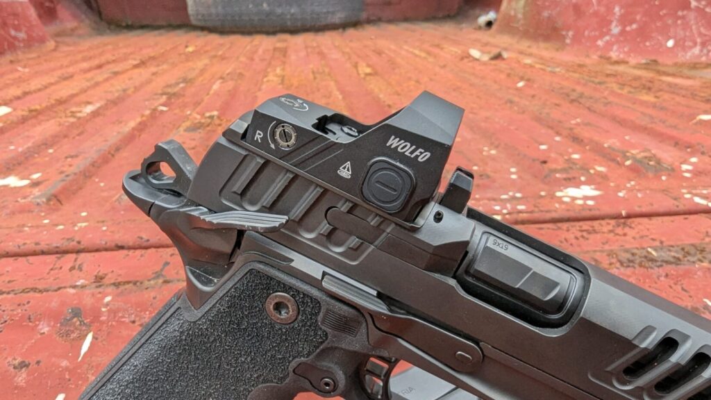 Close-up of the rear of a Staccato P pistol, showing a WOLF0 red dot optic and the rear sight.