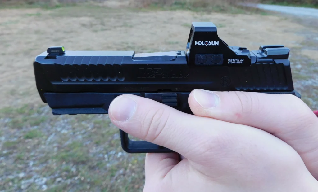 A Holosun 407K X2 red dot on a semiautomatic pistol