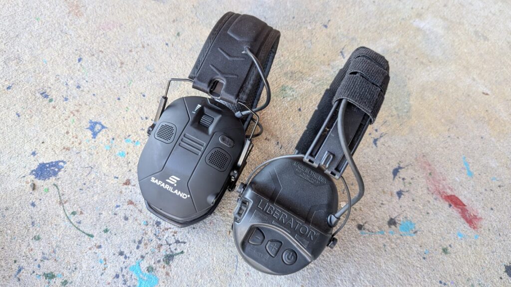 Top-down view of two pairs of black hearing protection, one Safariland branded and one Liberator branded.