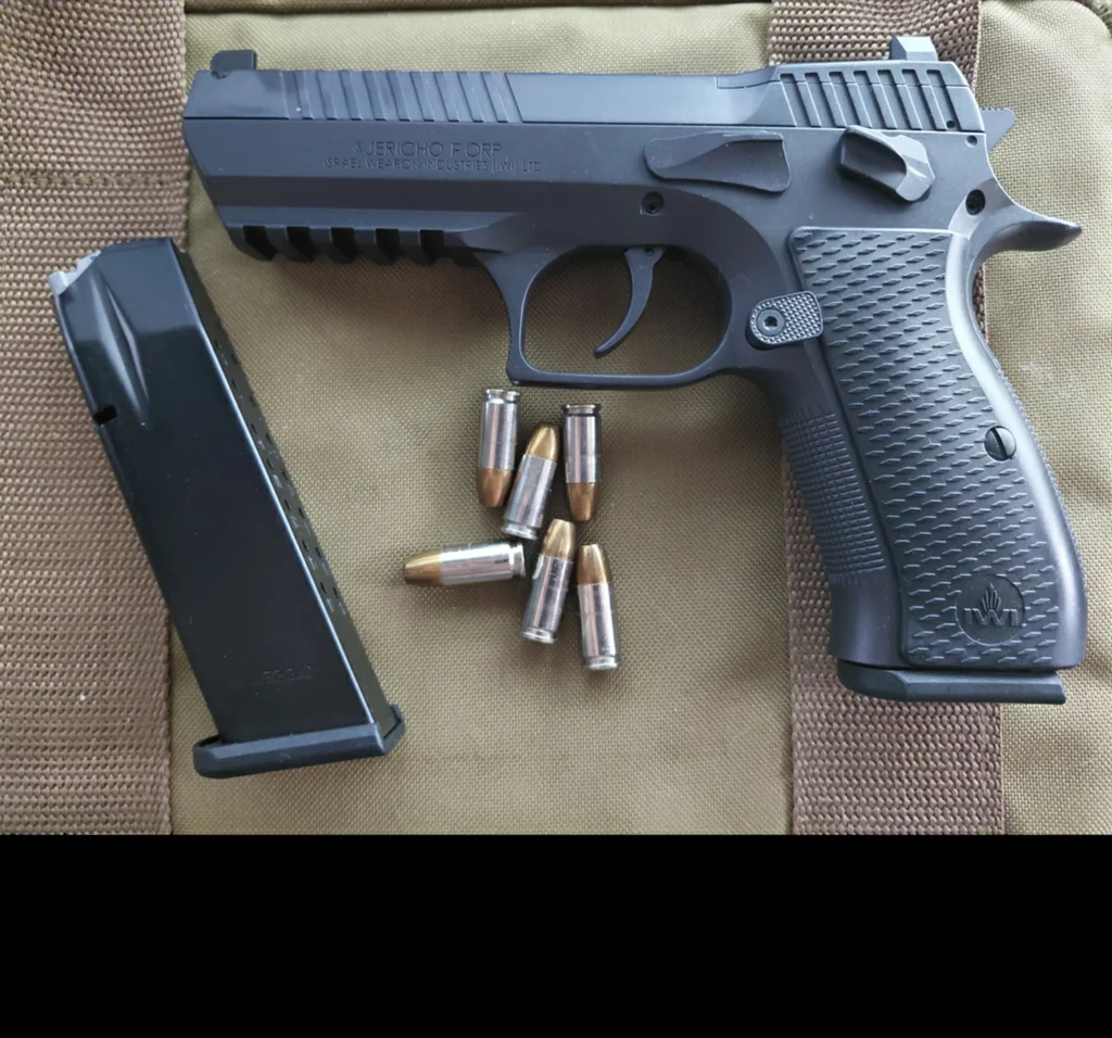 IWI Jericho 941 F ORP pistol with magazine and 9mm cartridges