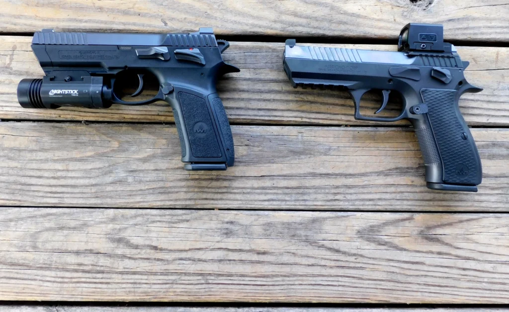 Two semiautomatic handguns lying on a table