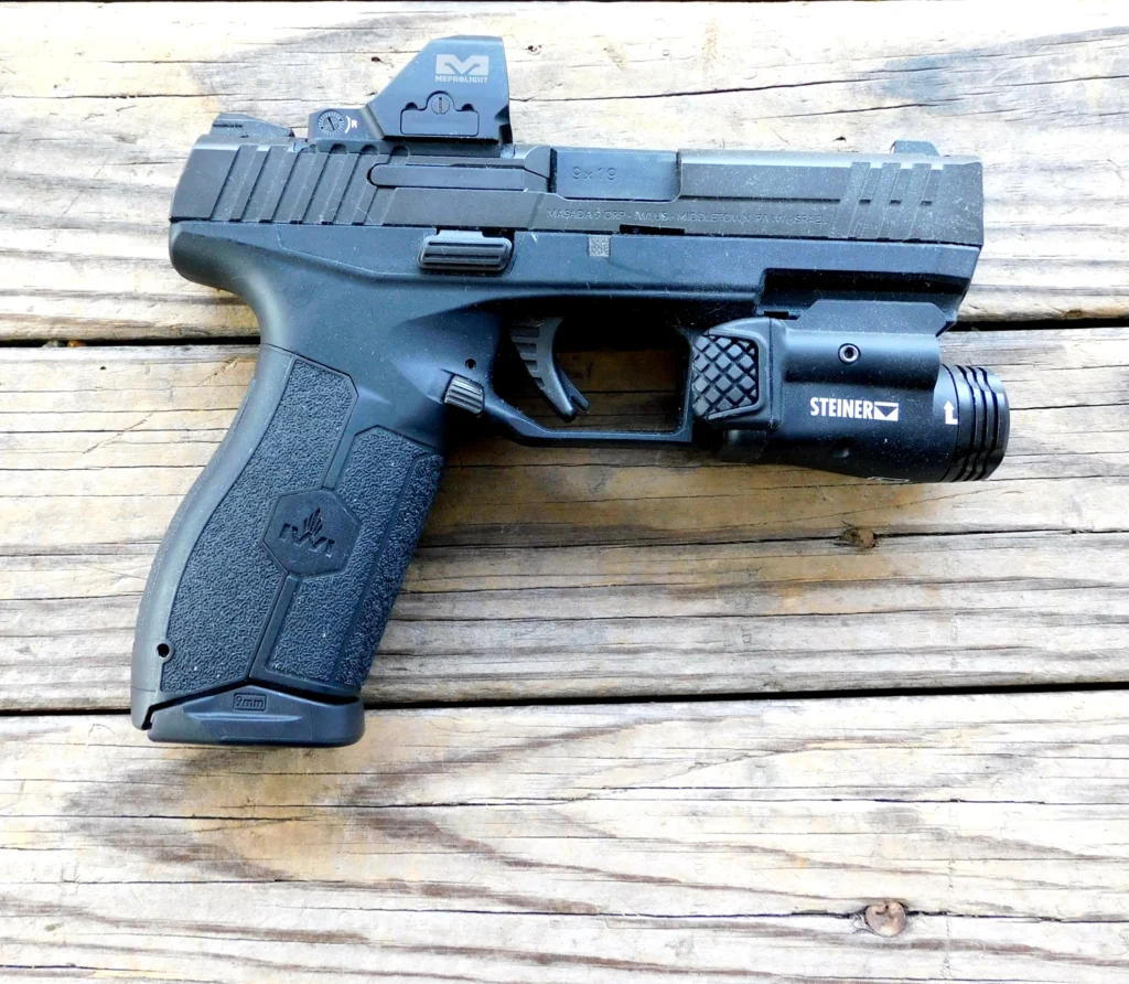 IWI Masada pistol with a red dot and weapon light