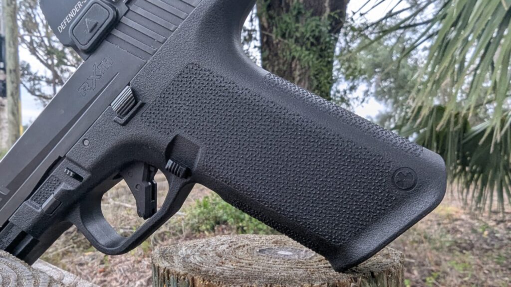Extreme close-up of the highly textured grip of the Ruger RXM pistol frame