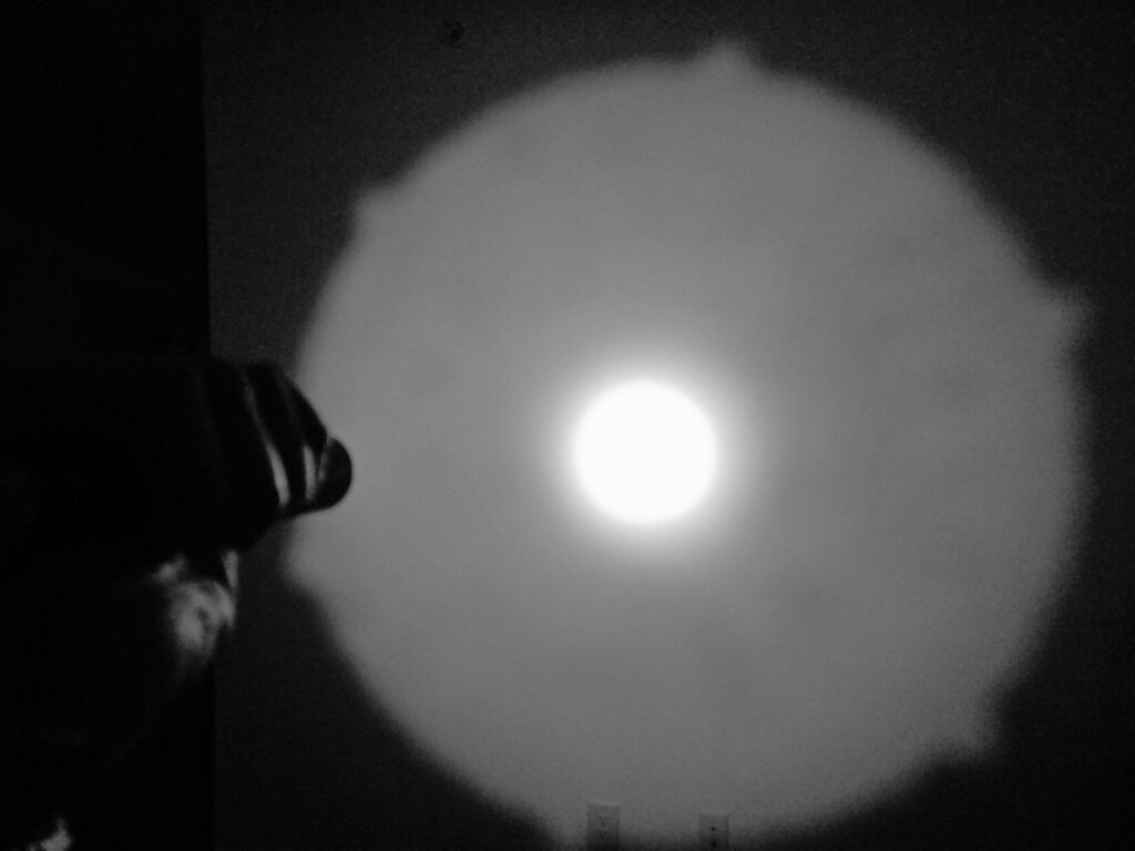 A spotlight against a white wall