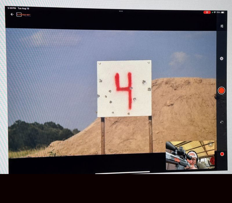 A screenshot of a target on the range with a red "4" on it. 