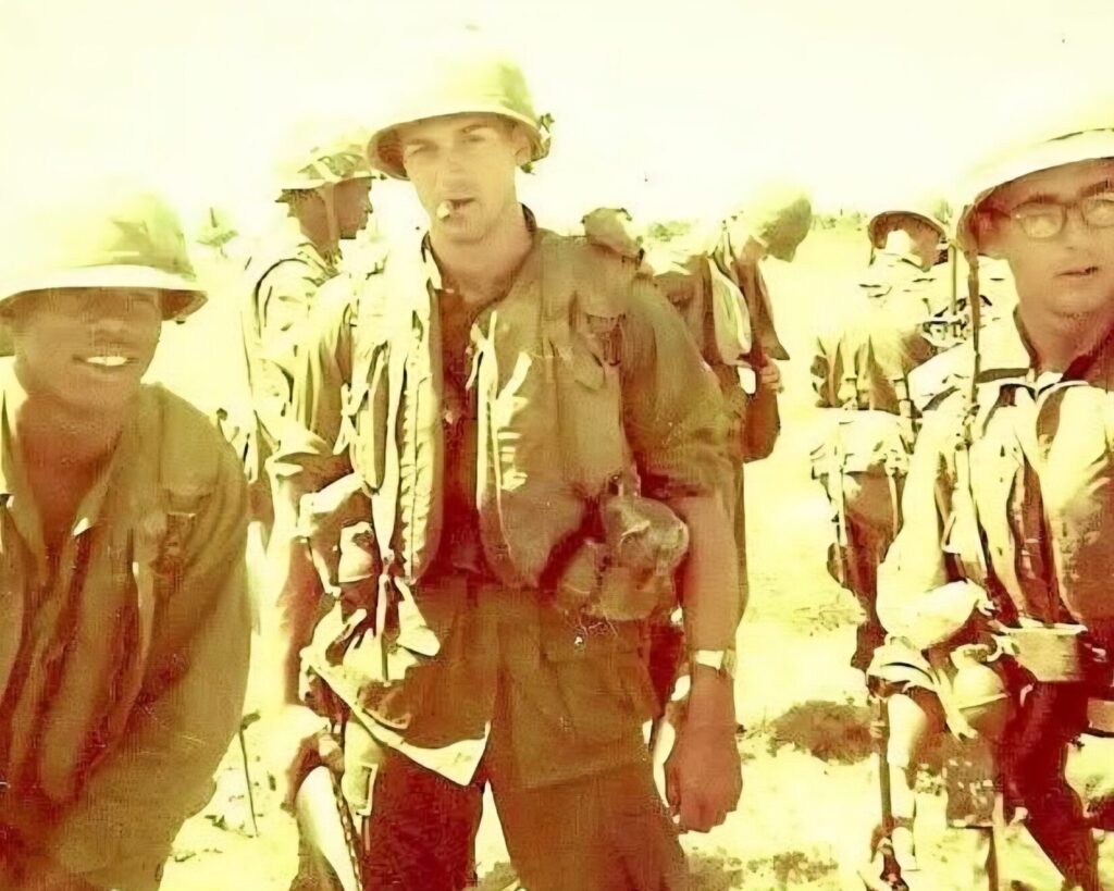 An old photo from Vietnam featuring three soldiers