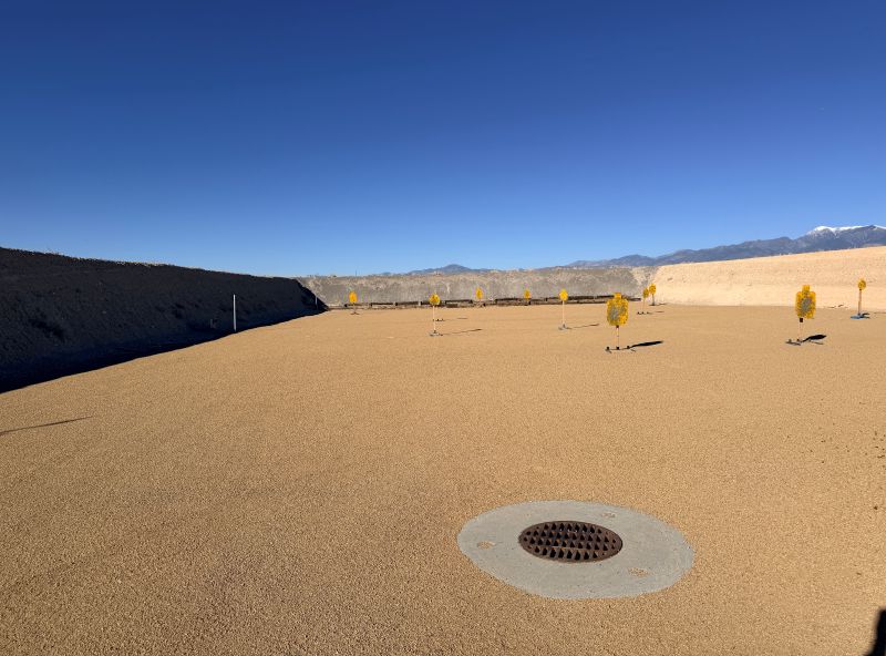 A brown range with yellow targets. 