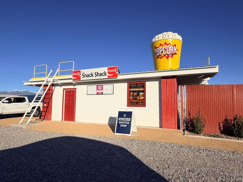 A red and white building with a sign that says "Snack Shack" built into the range for training. 