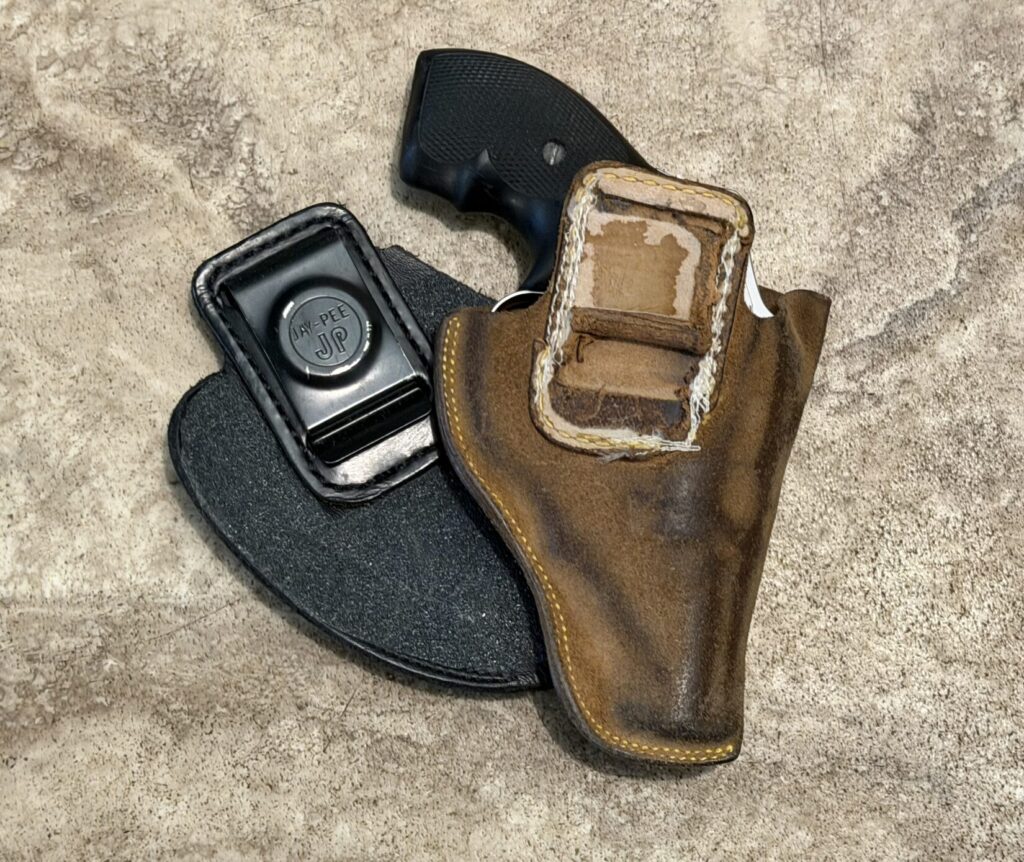 two worn out jay-pee holsters, j frame revolver holsters
