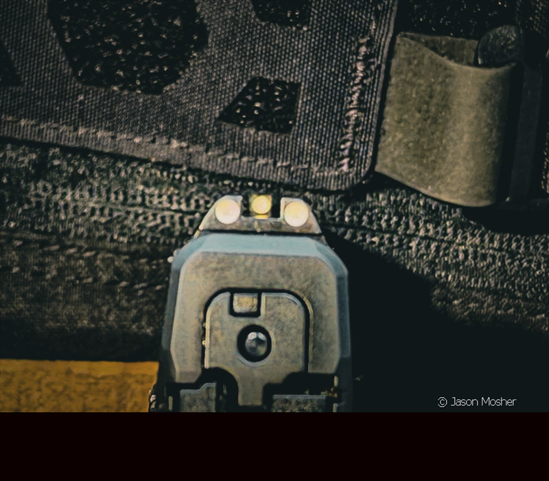 looking from the back of the gun and seeing three white, block style sights on the PPS M2 handgun.