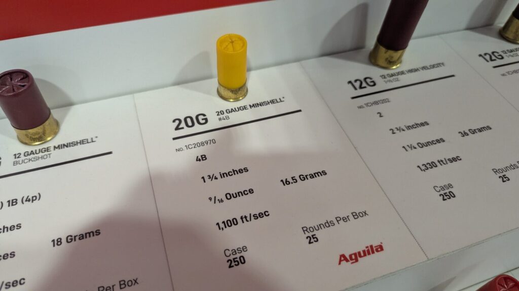 A display card for Aguila 20 Gauge Minishells showing a yellow shotgun shell and technical specifications