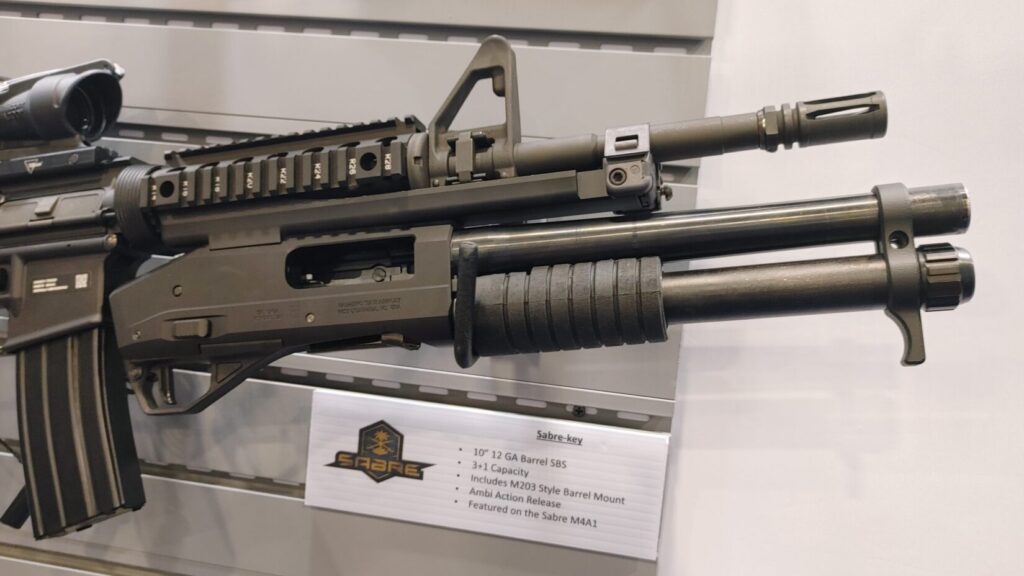 A side profile of the Sabre-key under-barrel shotgun, highlighting its 10-inch barrel and M203-style mounting system.