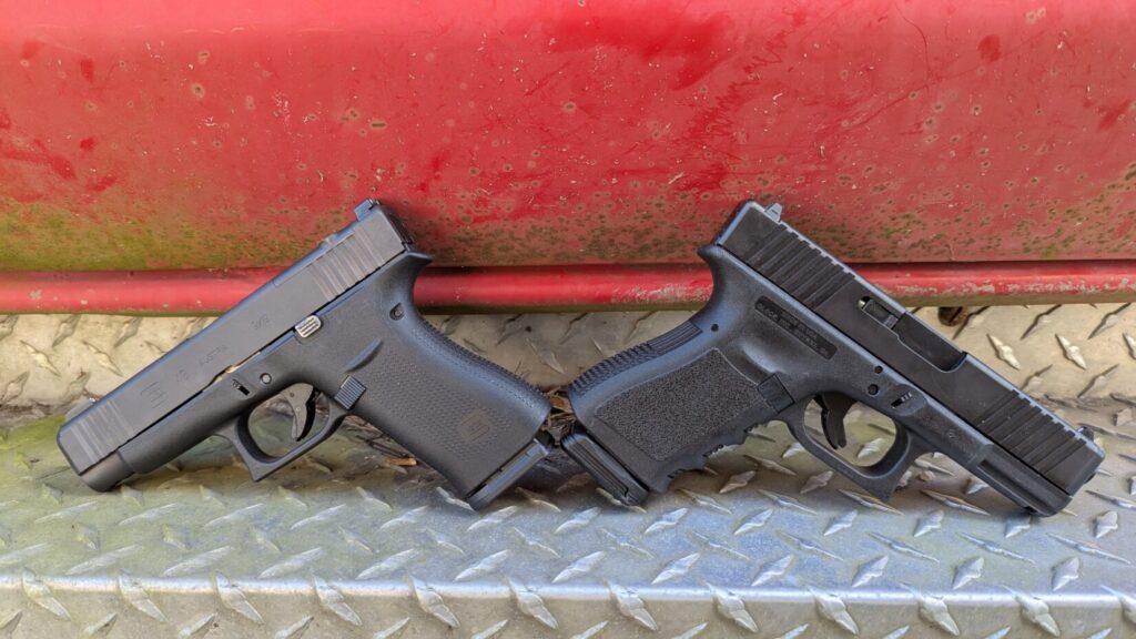 Side-by-side comparison of a Glock 48 (left) and a Glock 19 (right) against a red background.